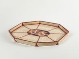 a small tray with a flower design on it