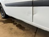 a white car with a black stripe on the side of it