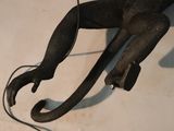 a statue of a monkey that is sitting on a table