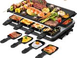 a close up of a grill with many different foods on it