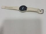 samsung smart watch with a white band and a black watch face