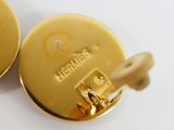 a close up of a pair of gold colored buttons