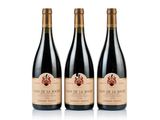 three bottles of red wine on a white background