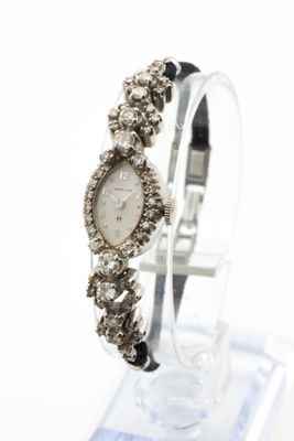 HAMILTON. Montre de dame en or gris ( 14K/ 585 millièmes) se…