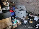 an image of a kitchen with a lot of clutter on the floor