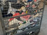 a metal cart with a lot of trash inside of it