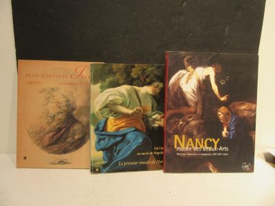 three books that are sitting on a table