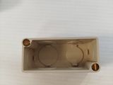 a plastic box with a hole in it on a white surface