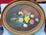 a picture of a painting of flowers in a gold frame