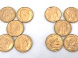 six different types of gold coins on a white surface