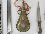 a lot of different types of knives on the table