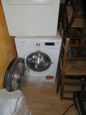 a washer and a dryer in a small room