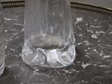 bottles of water sitting on top of a table next to each other