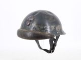 a helmet on a stand on a white surface