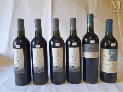 six bottles of wine are lined up in a row on a table