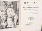 an open book with a picture of a statue on it