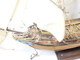 a model of a sailboat on display on a table