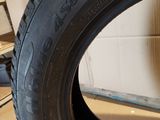 a close up of a tire on a wooden floor in a room