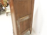 an old wooden cabinet in the corner of a room