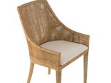 une photo d'une chaise en osier sur laquelle est posé un coussin