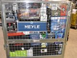 a metal cart with many items in it in a warehouse