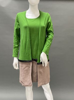 an image of a mannequin wearing a green top and pink shorts