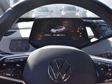 the steering wheel of a volkswagen vehicle with a display on the dashboard