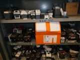 many different types of electronic equipment on a shelf