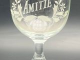 an empty wine glass sitting on a table