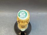 a bottle of beer that is sitting on a table
