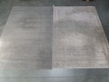 two rugs that are on the floor in the room