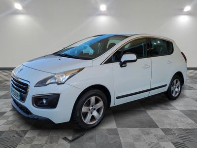 the white car is parked on a checkered floor in a garage