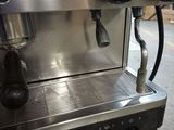 an image of a commercial coffee machine in a warehouse