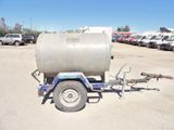 a trailer with a tank attached to it in a parking lot