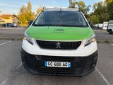 a green and white van parked in a parking lot