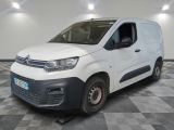 the white van is parked on a checkered floor in a room