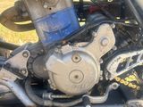 a close up of a motorcycle engine on the ground