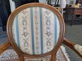 a chair that is sitting on a rug in a room