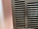 a small air conditioner sitting on top of a counter