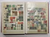 an open book with stamps on the pages and a picture of a cross on the page