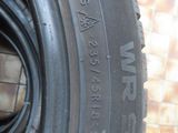 a close up of a tire on a brick wall