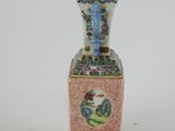 a vase that has a picture of a bird on it