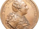 une image représentant une médaille d'or sur laquelle figure le portrait d'un homme