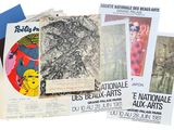 several posters of various types of art are displayed on a white surface
