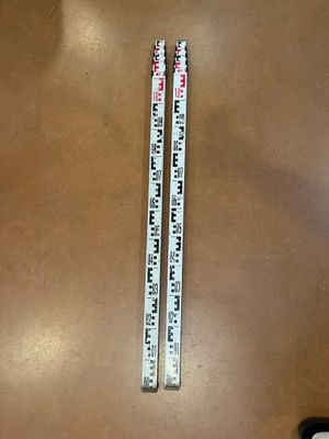 a ruler that is sitting on a table next to a pair of scissors