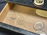 a small box with a lot of different things inside of it