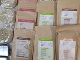 many bags of different types of food on a table