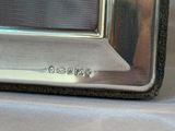 a close up of a silver microwave on a table