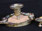 two candles that are sitting on top of each other