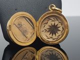 an image of a gold locke with a star on it